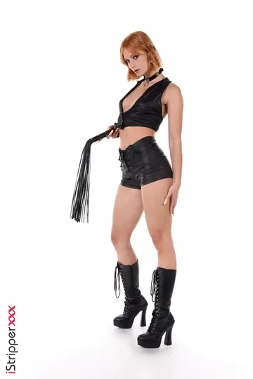 Dolly Dyson – Redhead in Leather Shorts and Boots Stuffs a Dildo
