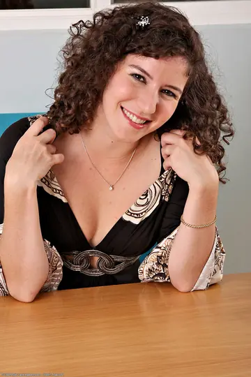 Curly Brunette Reveals Her Natural Tits and Hairy Pussy