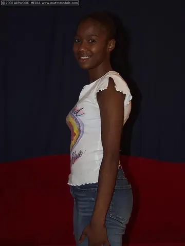 Ebony Babe Strips Out of Her Jeans and Shows Her Shaved Pussy