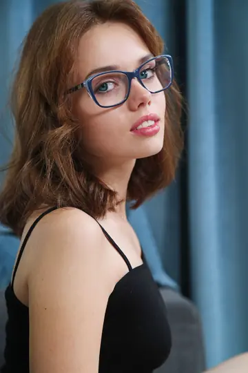 Short-Haired Brunette in Glasses Strips Off Her Bodysuit and Spreads Her Pussy