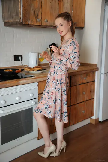 Woman Undresses Fully and Poses Nude in Glamour Set