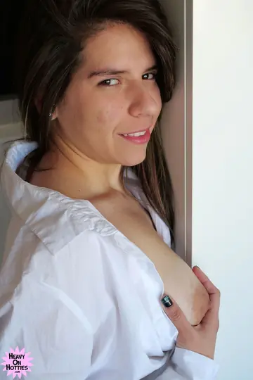 Colombian Latina Undresses and Fingers Her Shaved Pussy on the Bed