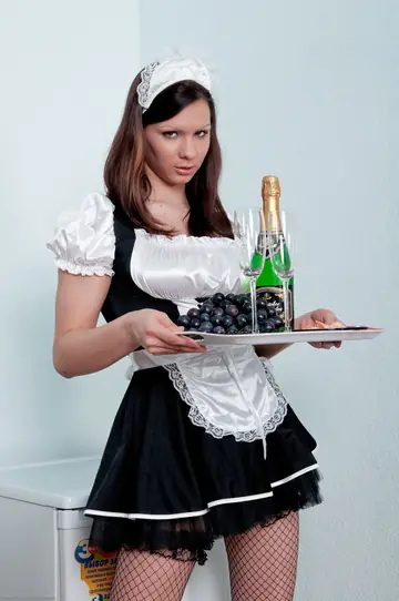 Woman Strips Out of Her Maid Uniform and Stockings