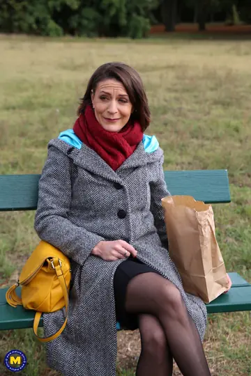 Mature French Woman Flashes Her Stockinged Legs Outdoors