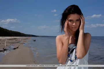 Brunette Lies Nude on a Seaside Hammock and Spreads Her Shaved Pussy