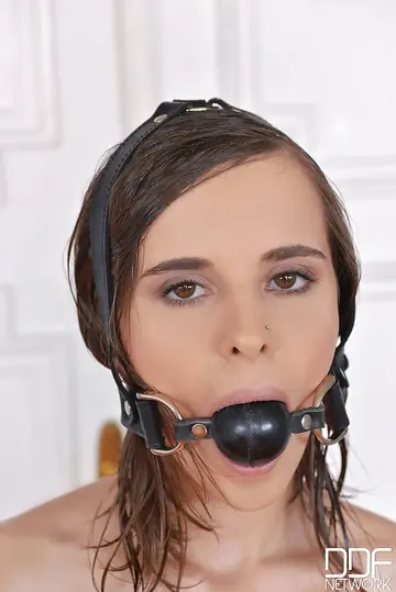 European Brunette in Bondage Gets Oiled and Spreads