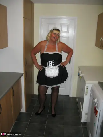 Curvy Mature Blonde Maid Strips Out of Her Uniform in the Kitchen