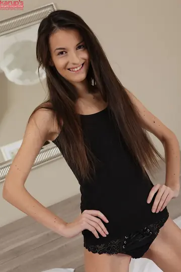 Slim Amateur Undresses and Spreads Her Shaved Pussy