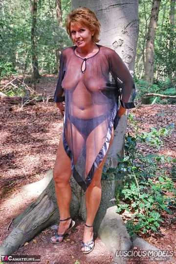 Busty European MILF Strips Out of Her Lingerie in the Woods