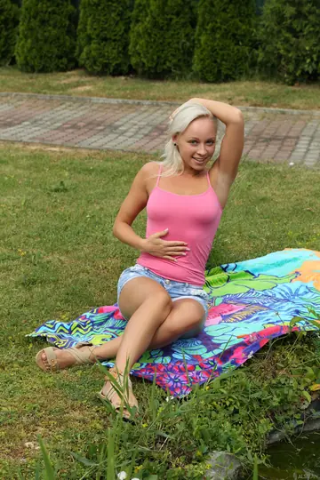 European Blonde Undresses and Spreads Outdoors