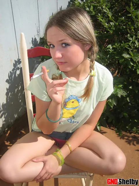 Woman in Pigtails Pulls Panties Aside Outdoors – photo 5 of 12