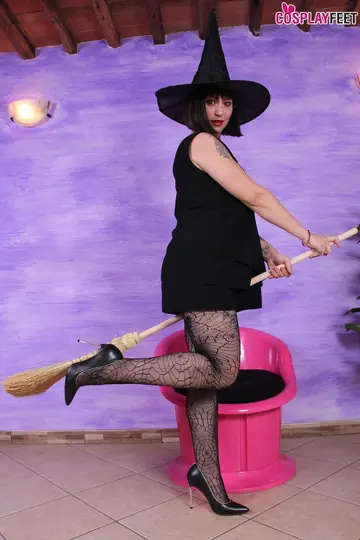 Tattooed Brunette Lifts Her Skirt to Reveal Halloween Pantyhose and Heels