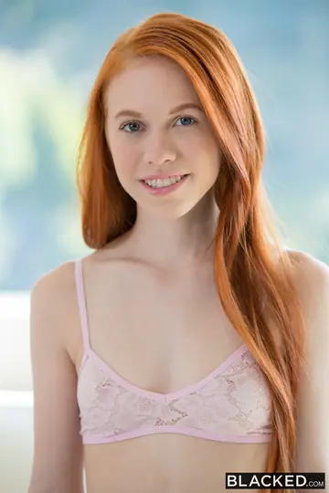 Petite Redhead Undresses for Interracial Sex with a Black Man