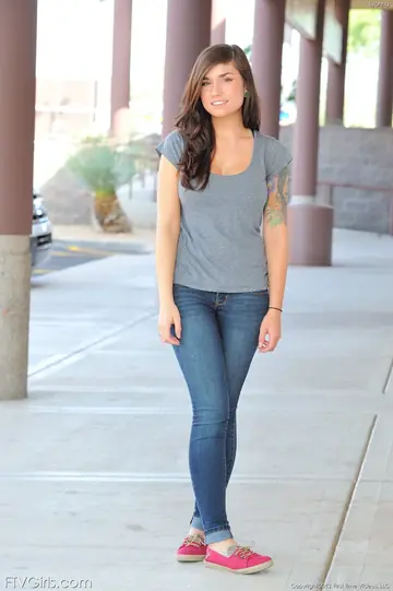 Brunette Shows Her Big Tits and Tattoos in Jeans Outdoors