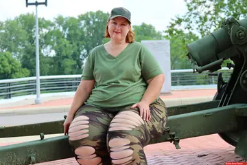 Mature PAWG Poses Outdoors on an Artillery Gun