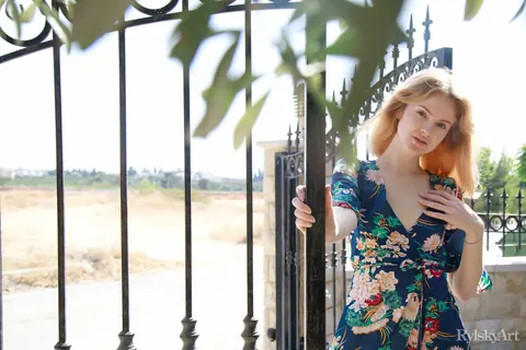 Alice May: Tall Redhead Bares All on a Garden Wall – photo 2 of 16