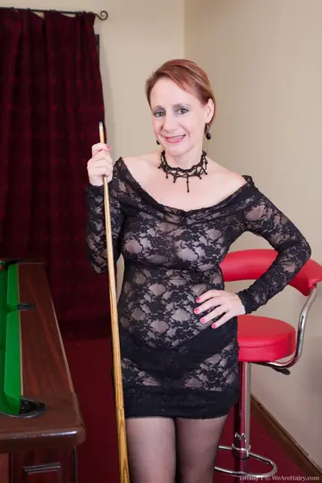 Short-Haired Mature Redhead Strips and Fingers Her Hairy Bush