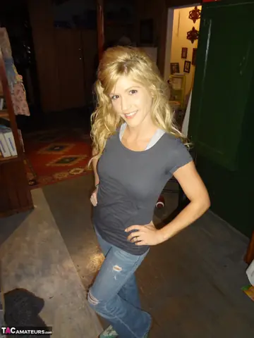 Jolene Devil – Petite Blonde MILF Strips Out of Her Skirt and Jeans on the Sofa