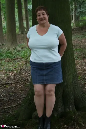 Kinky Carol – Curvy Mature Brunette Bares Her Huge Boobs in the Forest