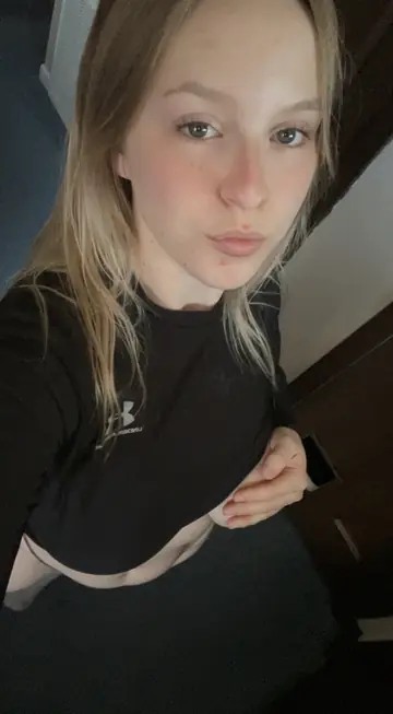 Blonde with Big Natural Tits Undresses and Poses Nude for the Lens