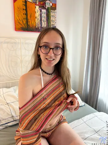 Woman in Glasses Strips Out of Her Lingerie on the Bed