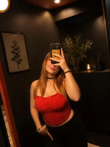 Slim Redhead with Big Tits Takes a Nude Selfie