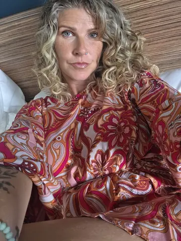 MILF with Curly Hair Takes Nude Mirror Selfies
