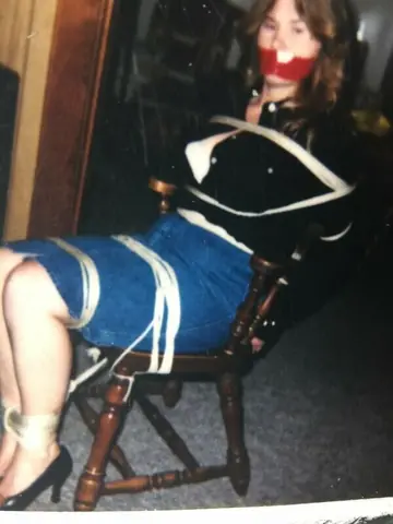 Busty Woman Restrained in Lingerie, Skirt and Heels for BDSM