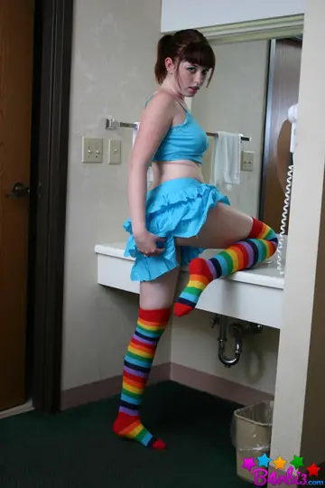 B4rbi3 – Busty Brunette in a Skirt and Socks Fingers Herself in the Bathroom