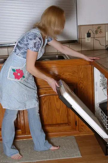 Pale Redhead MILF Unveils Trimmed Pussy in the Kitchen