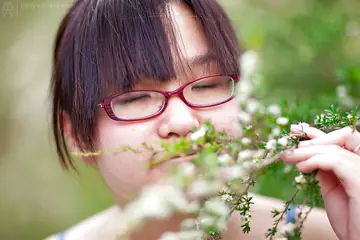 Asian Woman in Glasses Strips Out of Her Skirt Outdoors
