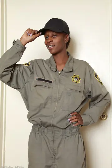 Busty Ebony Woman Strips Out of Her Uniform and Spreads for Anal