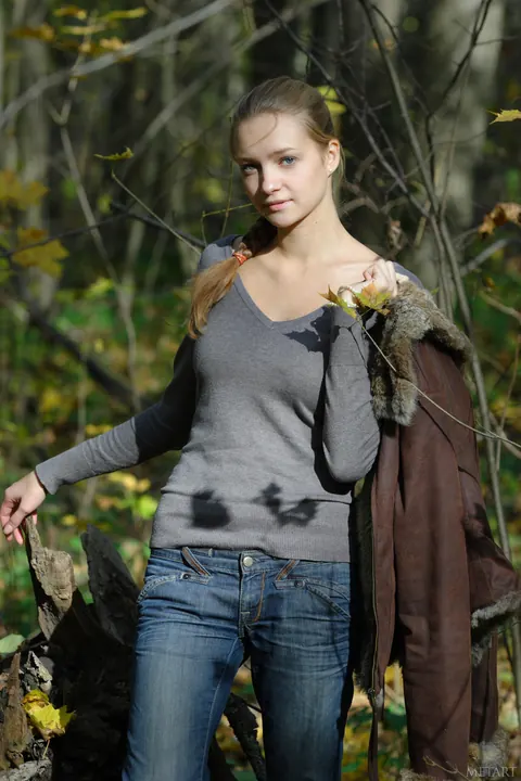 Woman in Pigtails Strips Out of Her Jeans in the Woods – photo 1 of 20