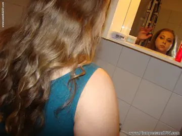 Curly-Haired BBW with Big Tits Exposes Her Body in the Bathroom