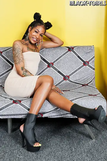 Ebony Trans Woman Stands Nude, Turns and Arches for the Camera