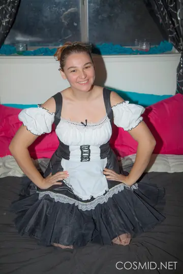 Busty Redhead Strips Off Her Costume and Kneels Naked