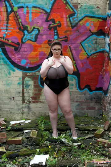 BBW Brunette Unleashes Her Big Tits Near Graffiti Outdoors