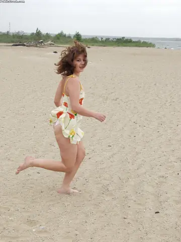Brunette Wades into Surf and Bares Her Hairy Pussy on the Beach