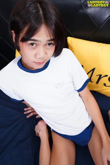 Asian Trans Woman Stands Nude, Arches Back and Lifts Chin to Show Her Figure
