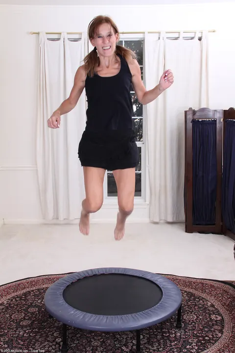 Jay Dee: Tall Redhead MILF Undresses and Fingers on Springy Surface – photo 2 of 20