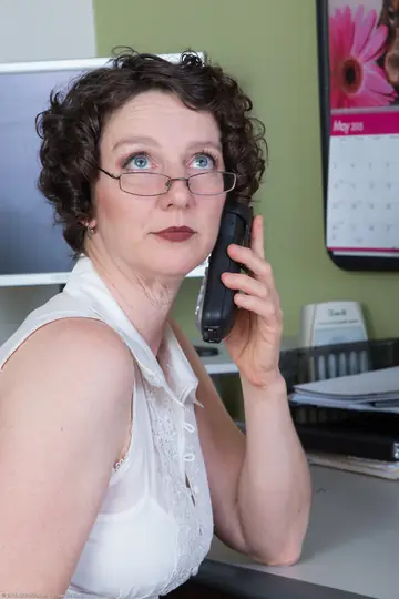 Curly Mature Secretary Spreads Her Hairy Pussy on the Desk