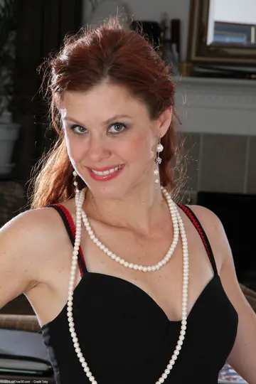 Redhead MILF Peels Off Her Dress and Spreads Her Legs
