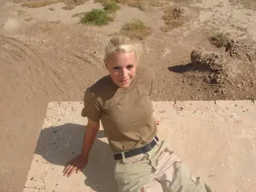 Blonde in a Military Uniform Strips Nude