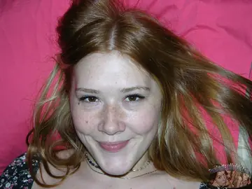 Redhead Spreads Her Trimmed Pussy on the Bed