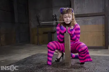 Harley Ace – Brunette in Costume and Heels Suspended for Lesbian BDSM