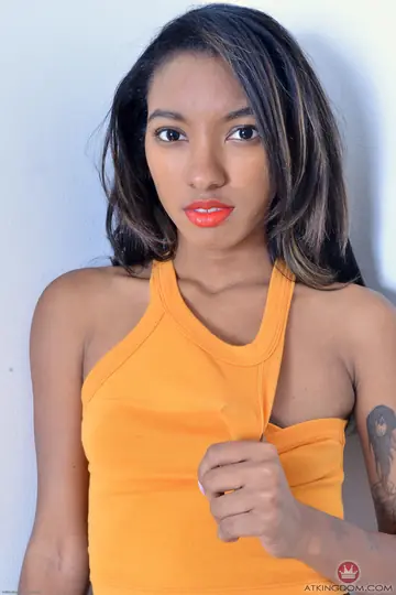 Slim Ebony Babe Removes Her Panties and Spreads Her Hairy Pussy