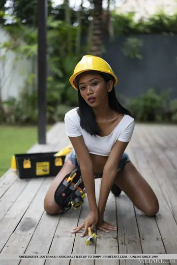 Asian Woman in Shorts and Construction Hat Spreads Her Pussy on the Porch