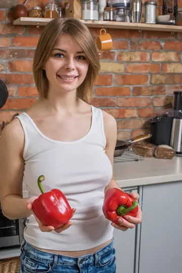 Busty Woman Strips Naked and Spreads Her Shaved Pussy in the Kitchen