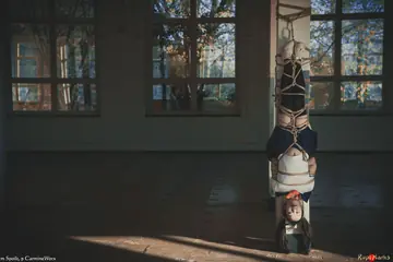 Japanese Woman in Uniform Skirt and Socks Tied Upside Down