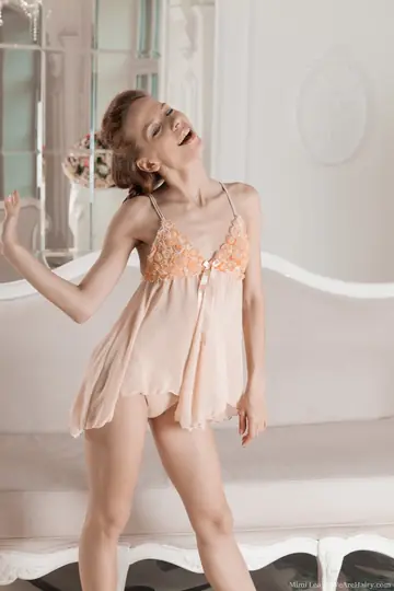 Slim Redhead Sheds Her Lingerie, Keeps Heels and Fingers Her Hairy Pussy